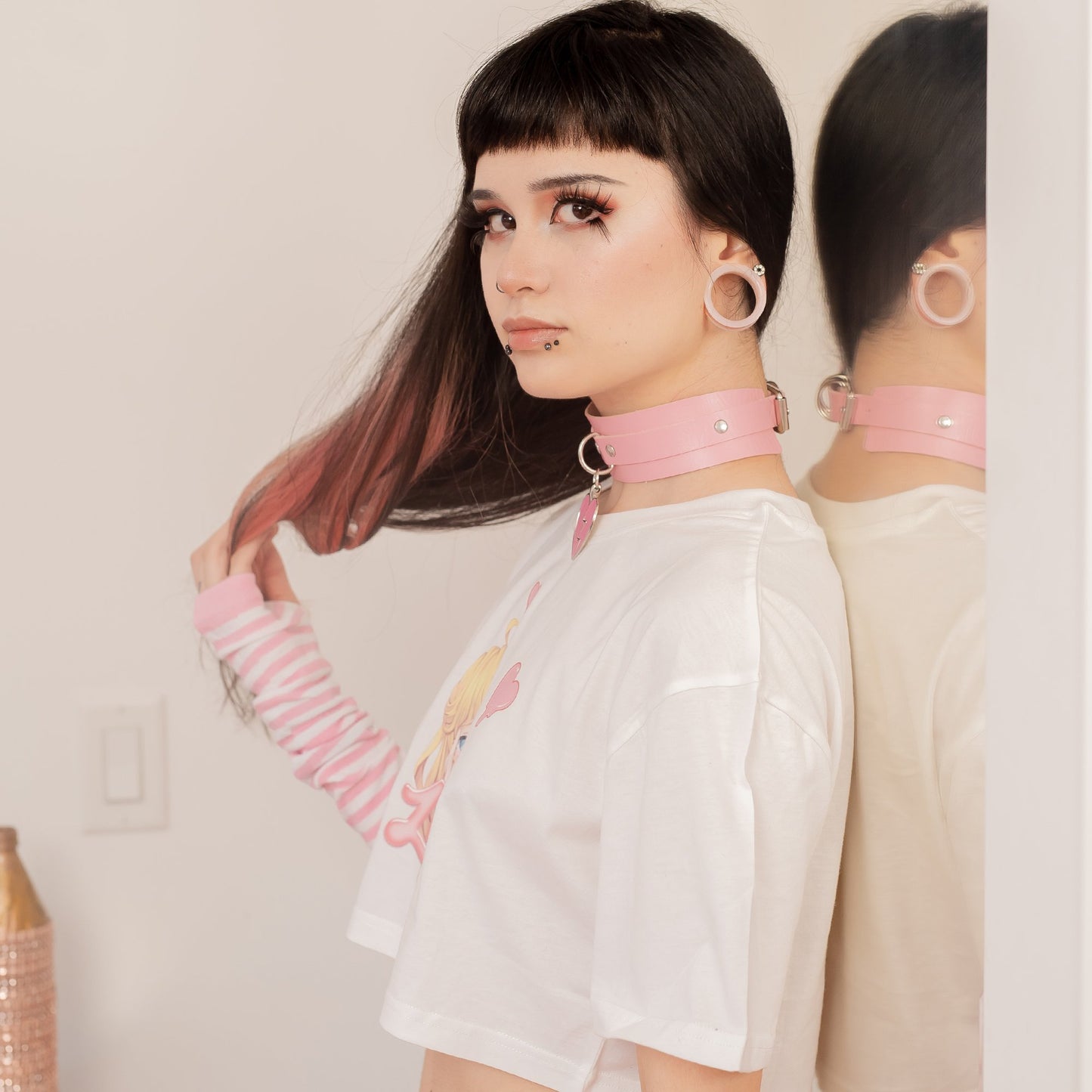 Morute Waifu Crop Top - White, super-short crop top featuring a yandere anime girl with an ahegao face and 'Lewd' in pink, paired with pink pasties for a playful and daring look.
