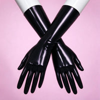 Dark Alert black patent opera gloves crossed on white mannequin forearms, close-up