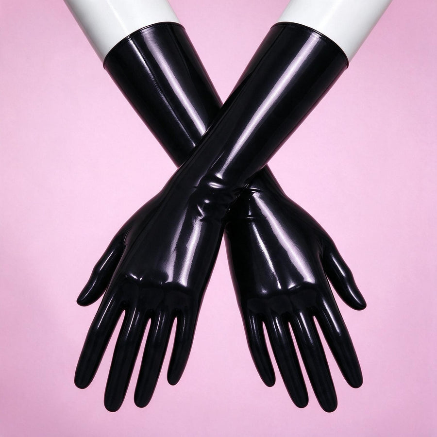 Dark Alert black patent opera gloves crossed on white mannequin forearms, close-up