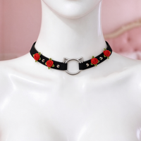 Rose Claw Choker in black with red roses, front view on a mannequin