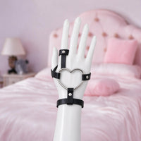 Heartgrip hand harness, front view on a mannequin hand, silver heart ring on the back of the hand