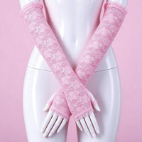 Doll Hands pink lace gloves close-up on a mannequin, floral lace crossed over the hips