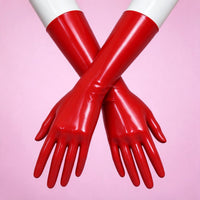 Red Alert red patent opera gloves crossed on white mannequin forearms, close-up