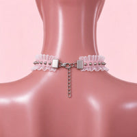 Halo Breaker Lace Choker in pink, back view showing the lobster clasp and silver extension chain