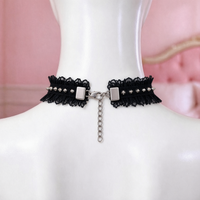 Feral Kitten Lace Choker in black, back view showing the lobster clasp and silver extension chain