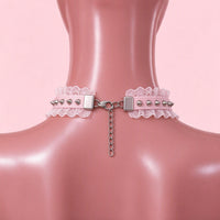 Feral Kitten Lace Choker in pink, back view showing the lobster clasp and silver extension chain