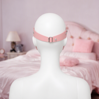 Blind Date cross strap eye mask in pink, back view showing the buckle strap