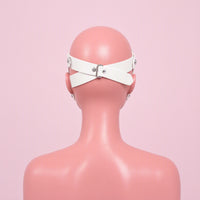 Blind Date white cross strap eye mask, back view showing the buckle strap