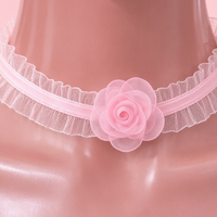 Poison Bloom Lace Choker in pink, close-up of the centre detail