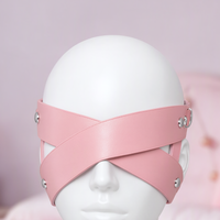 Blind Date cross strap eye mask, close-up of the silver rivets and O-ring