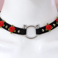 Rose Claw Choker in black with red roses, close-up of the centre detail