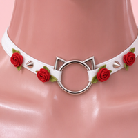 Rose Claw Choker in white with red roses, close-up of the centre detail