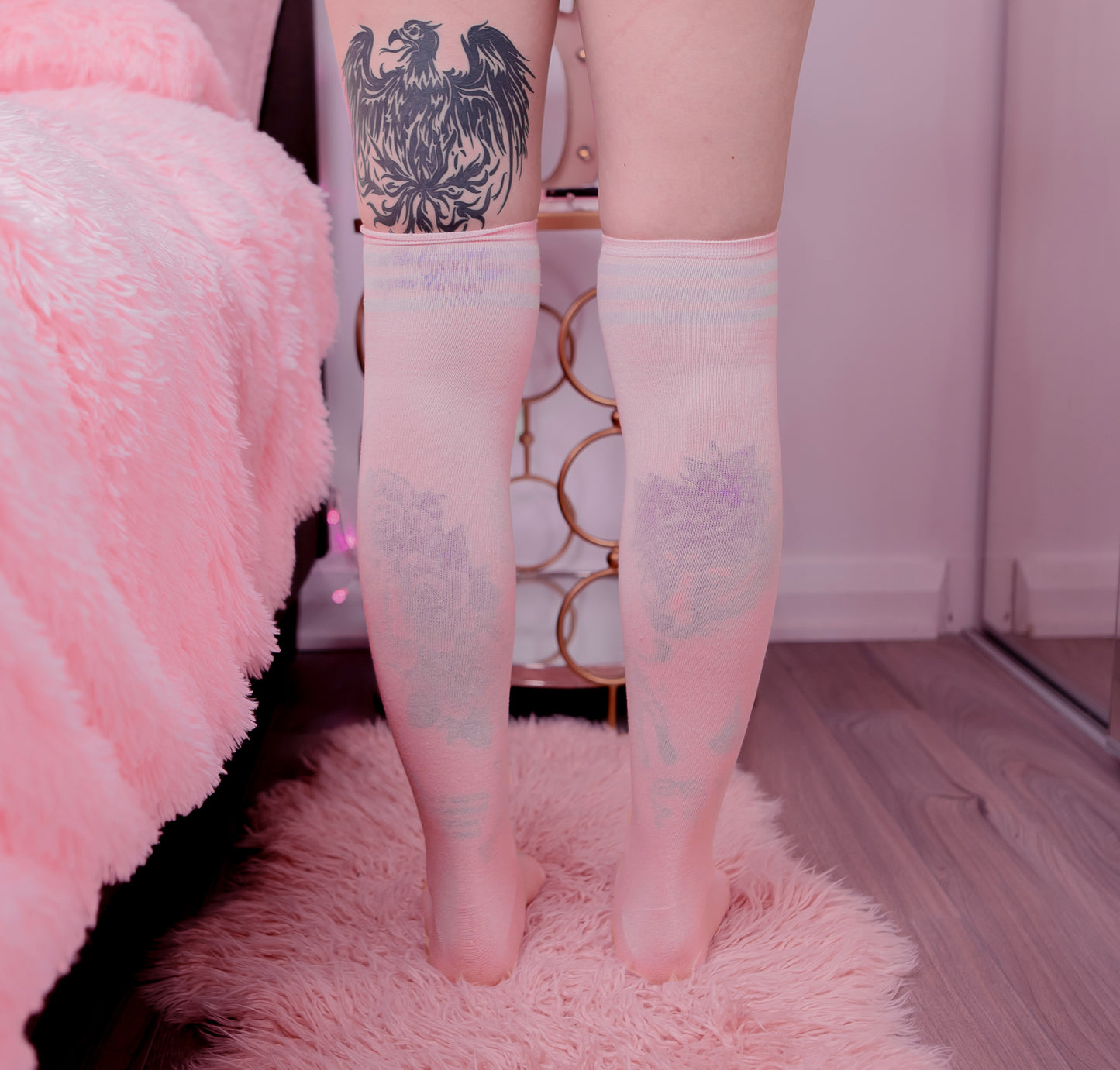 Pink thigh-high shimapan socks with white stripes, soft knit fabric, modeled in kawaii bedroom setup for anime cosplay and OnlyFans outfits.