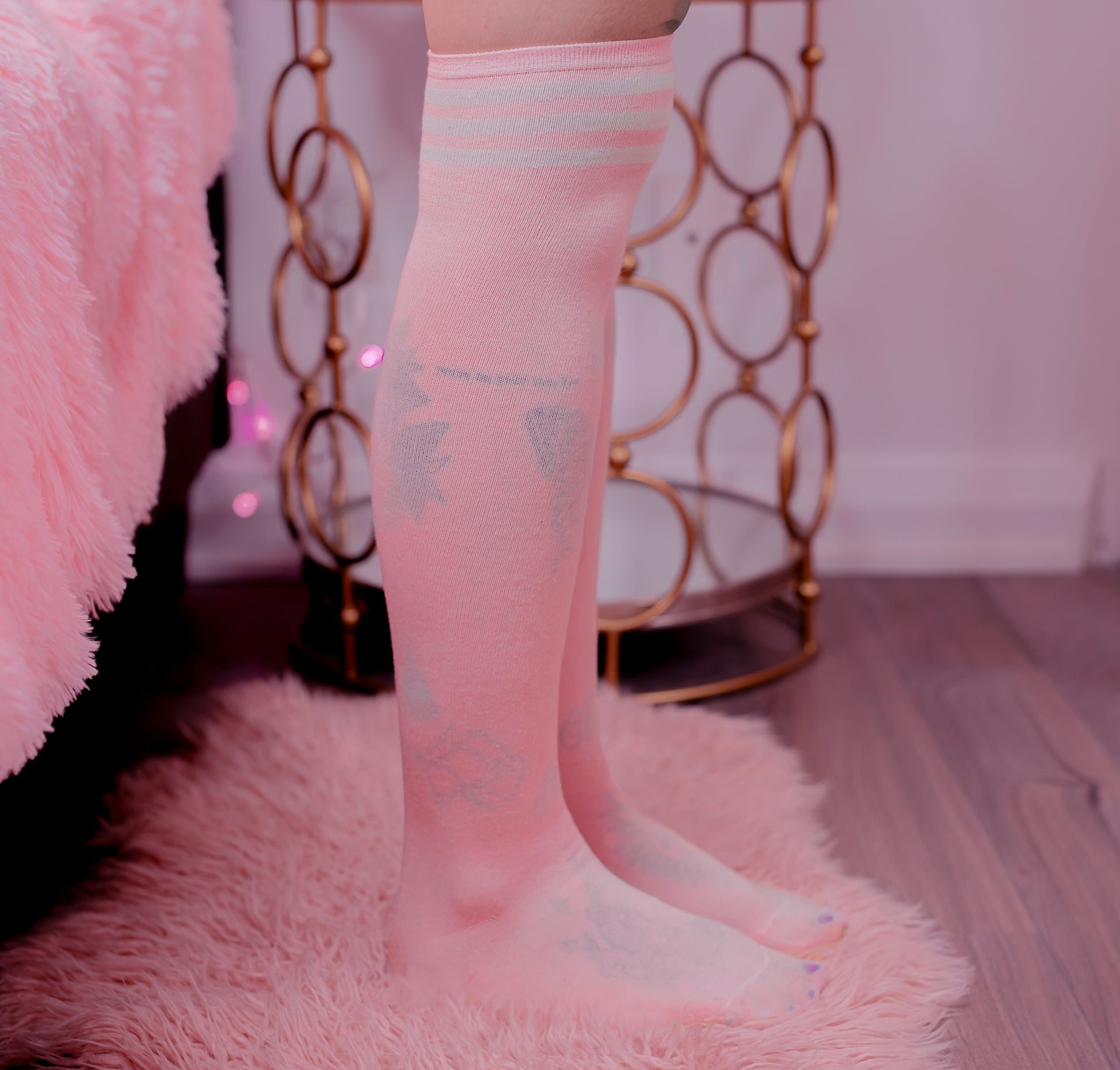 Pink thigh-high shimapan socks with white stripes, soft knit fabric, modeled in kawaii bedroom setup for anime cosplay and OnlyFans outfits.