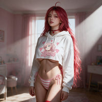 Akane in window light wearing the white crop hoodie, daylight across the print
