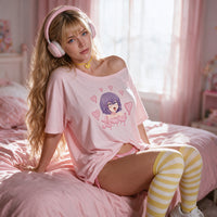 Lewd Otaku pink oversized shirt — seated with the shoulder pulled down