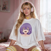Purple Ahegao white oversized shirt — kneeling on the bed with the print flat to camera