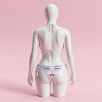Back view of the Blue Ahegao Bikini on a white hourglass mannequin in a pink studio