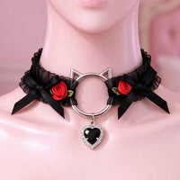 Black lace cat ear choker close-up of the cat-ear ring, bows and crystal heart