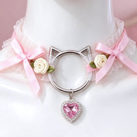 Pink lace cat ear choker close-up of the cat-ear ring, bows and crystal heart