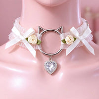 White lace cat ear choker close-up of the cat-ear ring, bows and crystal heart