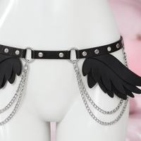Flight Risk feather wing hip belt with chains, close-up of the straps and silver-tone hardware