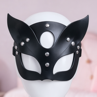 Feline Fine mask, close-up of the straps and silver-tone hardware