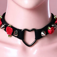 Thorn Heart Choker in black with red roses, close-up of the centre detail