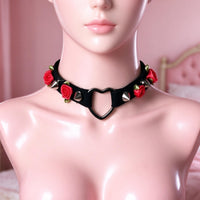 Thorn Heart Choker in black with red roses, front view on a mannequin