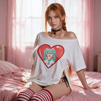 Sitting on the bed in the white side peek top, relaxed, the red heart print on show