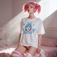 Model standing in window light, the oversized tee draping past the hips with the print full to camera