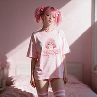 Window light across the pink oversized shirt and the busty anime girl print