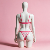 Back view of the Ahegao Face Pink Mesh Bikini on a white hourglass mannequin in a pink studio