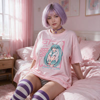 Certified Cutie Pink Oversized Shirt — seated on pink bedding, the print on show