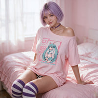 Certified Cutie Pink Oversized Shirt — seated on the bed edge