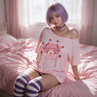 Strawberry Ahegao pink oversized shirt — seated with the shoulder pulled down