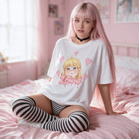 Yandere Crashout White Oversized Shirt — seated on pink bedding, the print on show