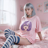 Purple Ahegao pink oversized shirt — seated on a pink bed with striped thigh highs