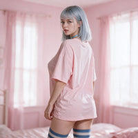 Purple Ahegao pink oversized shirt — standing in soft window light