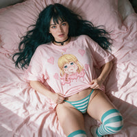 Yandere Crashout Pink Oversized Shirt — reclining on pink bedding, lifting the hem