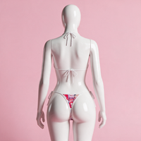 Back view of the Ahegao Chaos Bikini on a white hourglass mannequin in a pink studio