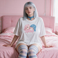 Yuri Tension Oversized Waifu Shirt seated against a pink headboard - loose drop shoulder anime tee